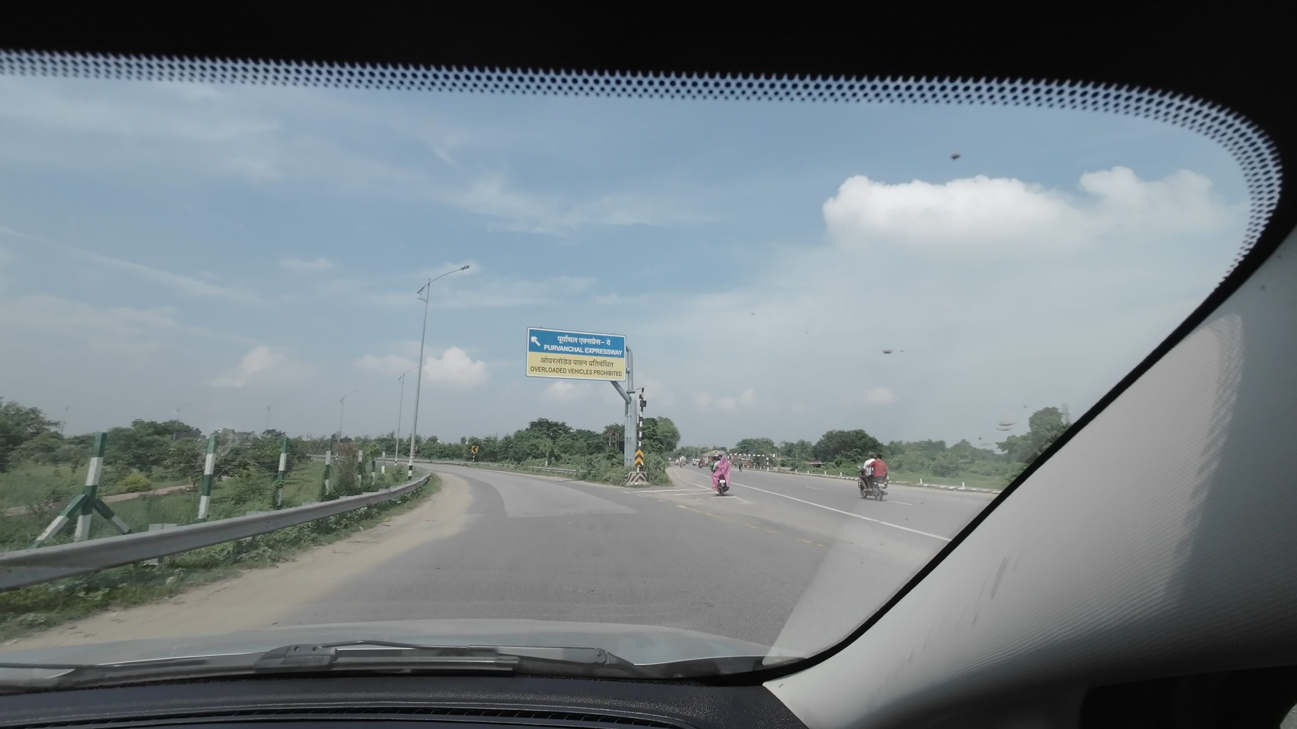 The official Welcome to Purvanchal Expressway signboard marking the entry ramp onto the six-lane access-controlled highway in Uttar Pradesh