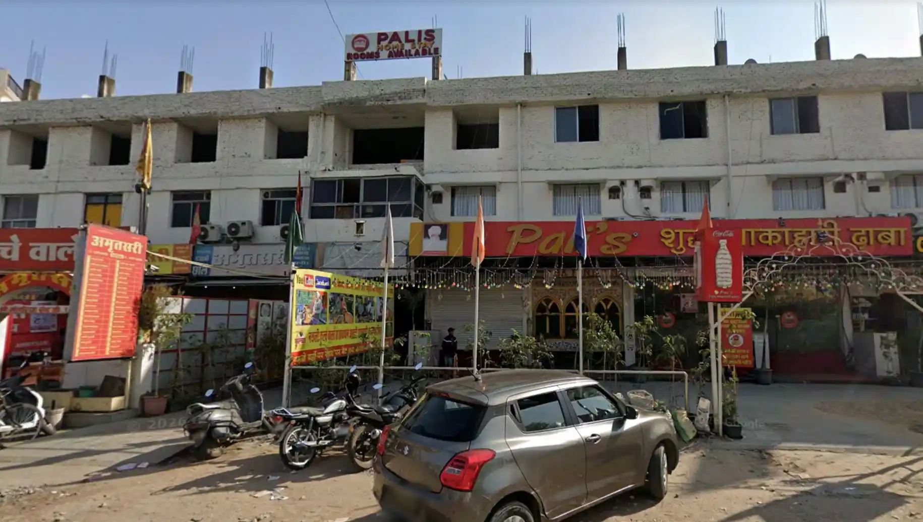 The welcoming exterior and cozy setup of Hotel Pali Stay in the modern Raja Park neighborhood of Jaipur