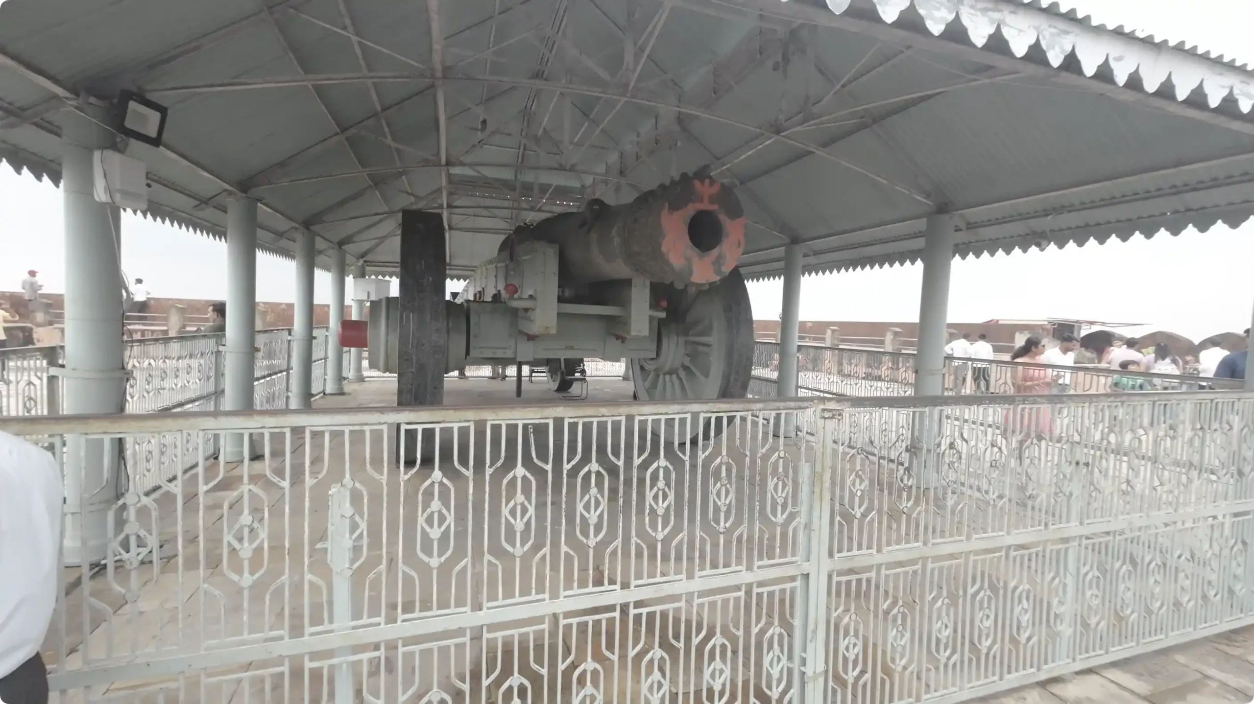 The massive iron barrel and giant wooden wheels of the historic Jaiwana Cannon displayed at Jaigarh Fort in Jaipur