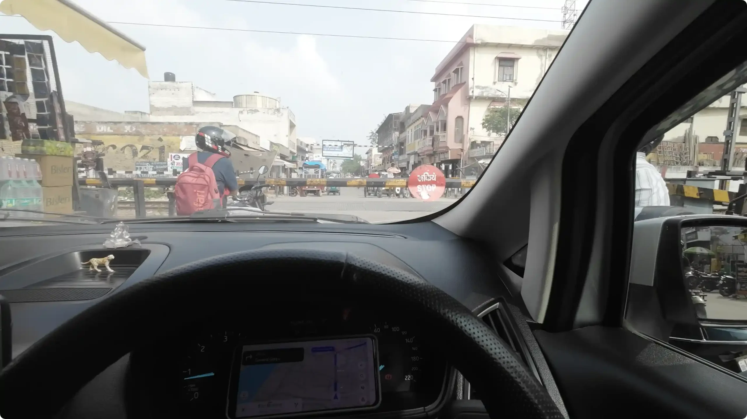Cars and auto-rickshaws stuck in heavy traffic on the extremely narrow street lanes leading to Shri Dwarkadhish Temple in Mathura