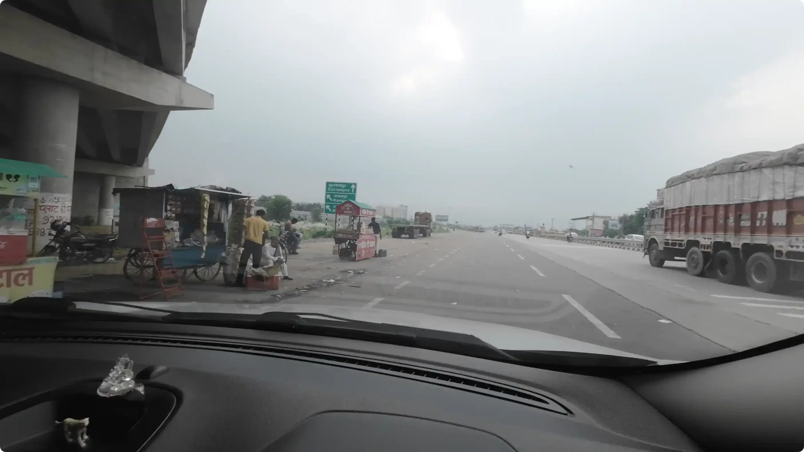 A view from inside the car looking at the Purvanchal Expressway entry road where we stopped for early morning tea